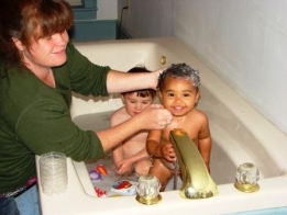kids in a tub of domestic hot water