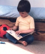 Child sitting on warm floor.