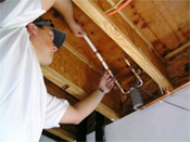 Worker installing tubing